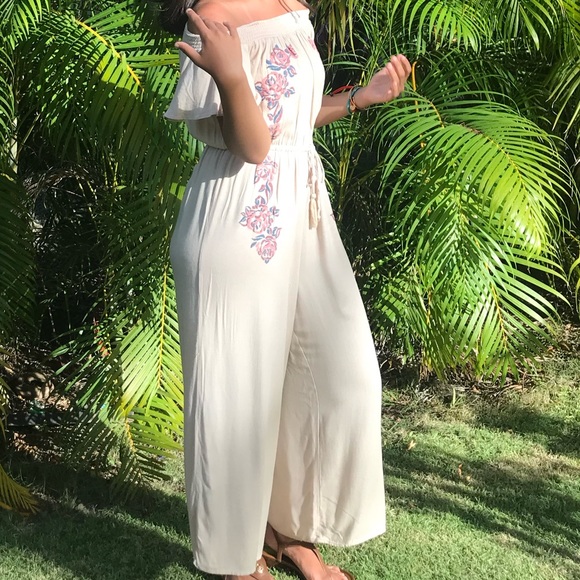 American Rag Pants - Flowy beige jumpsuit with floral print